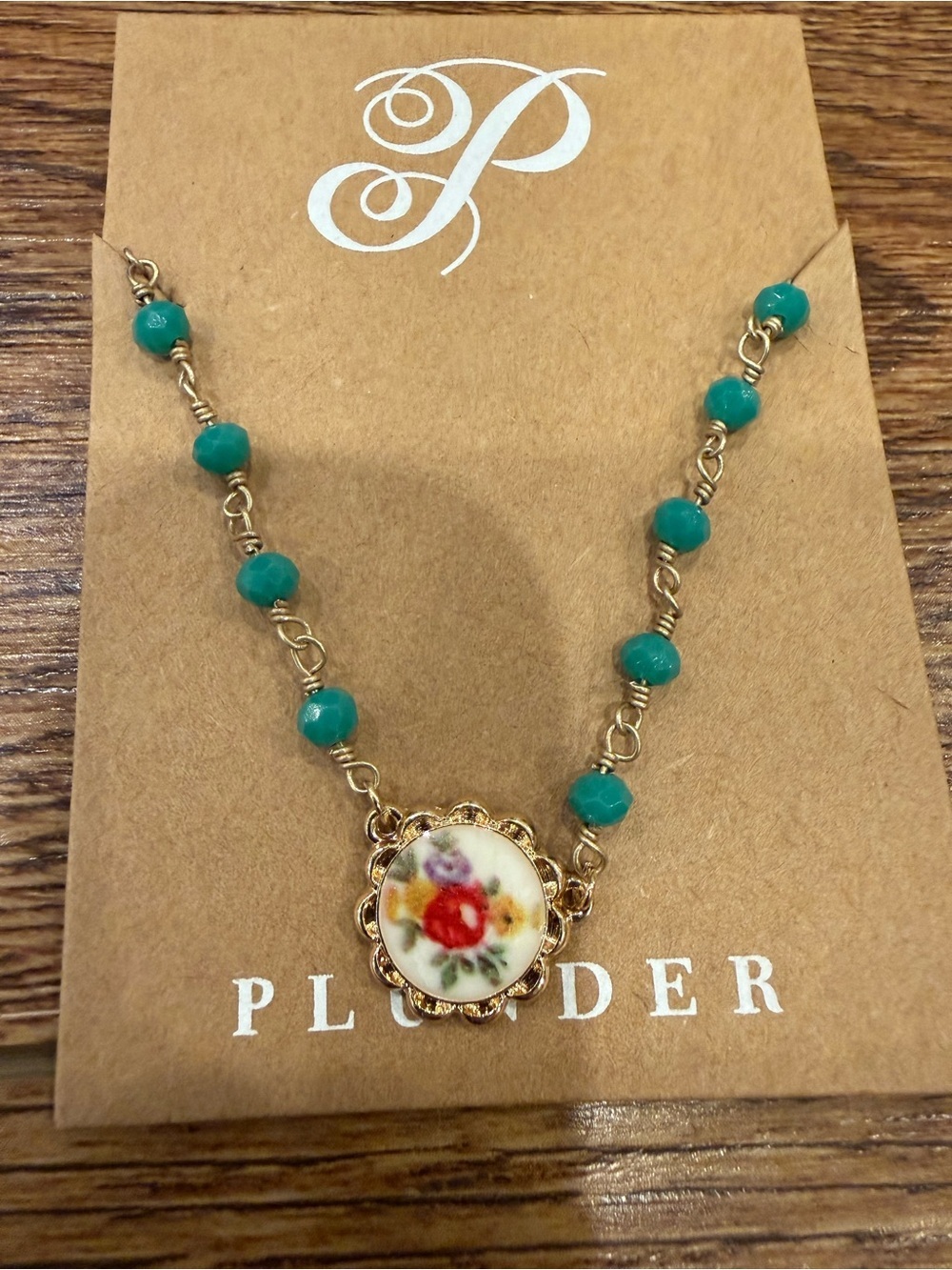 Plunder Teal Beaded Necklace with Floral Porcelain Medallion and Gold Accents